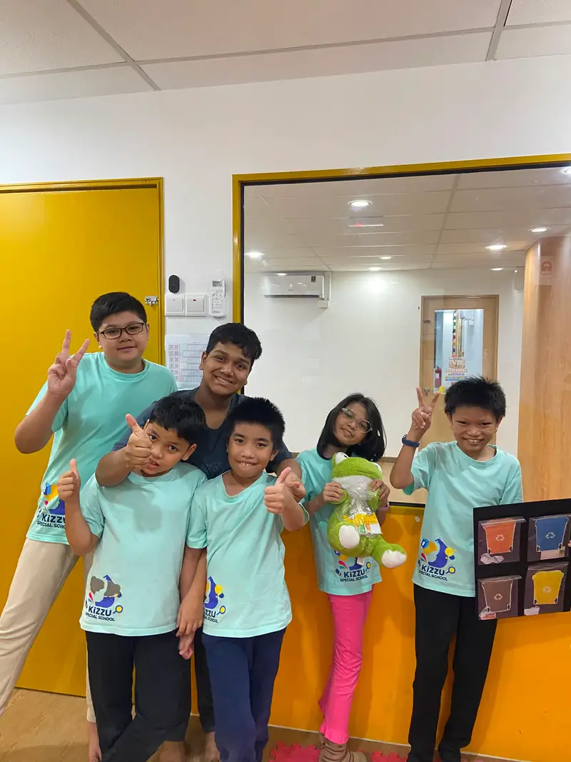 A group of KSS learners celebrating shared project work