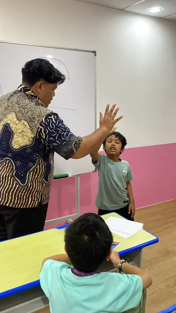 An educator encouraging active classroom participation